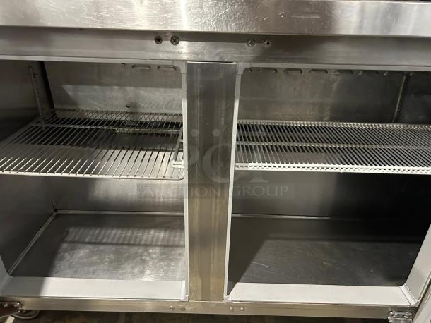 Continental SW72-N-BS 72" worktop refrigerator with backsplash, stainless steel, showing interior shelving, excellent condition.