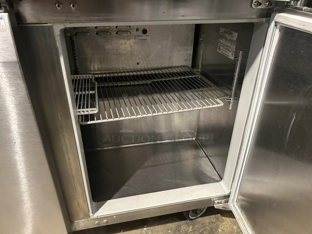 Continental Refrigerator SW72-N-BS, stainless steel, interior shelf, open door view. Good condition, model label inside.