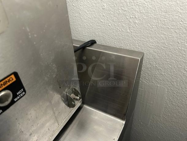 Continental Refrigerator SW72-N-BS, 72" worktop with backsplash, stainless steel, minor surface marks, visible power cord.