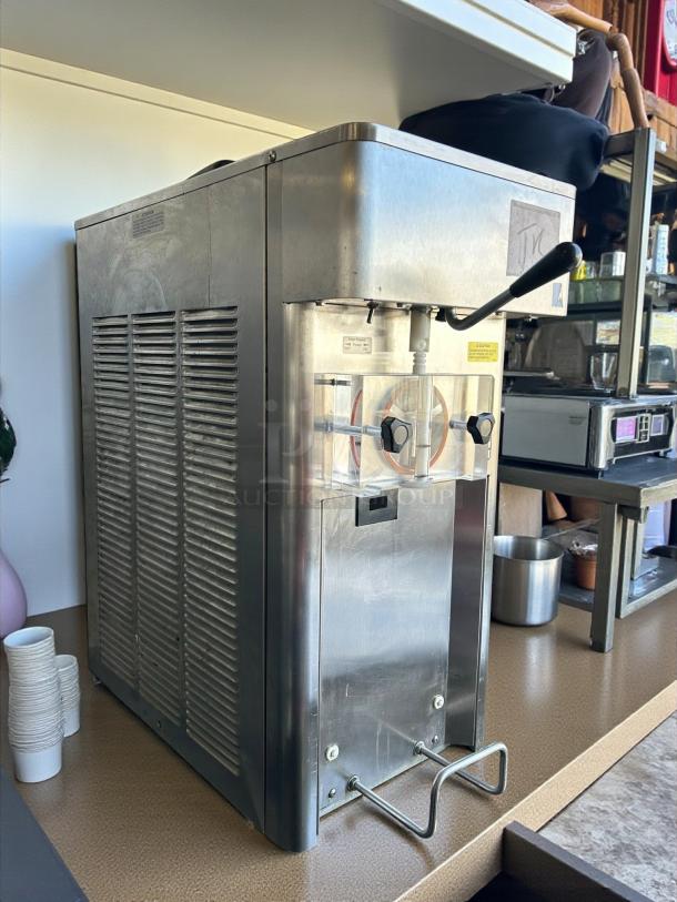Stoelting F111 gravity-fed soft serve machine in excellent condition, stainless steel, tested and working.