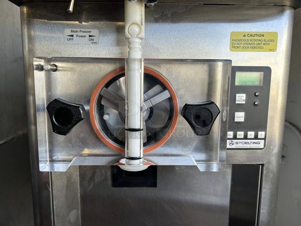 Stoelting F111 soft serve machine in excellent condition. Features control panel, power switch, and caution labels. Tested, working.