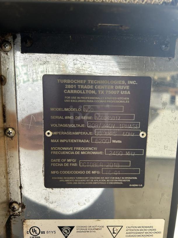 TurboChef I1 SOTA oven label showing model, voltage, amperage, manufacture date, and safety certifications.