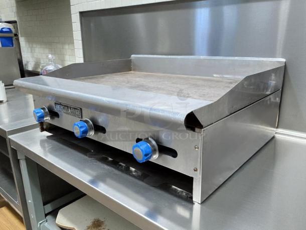 Imperial ITG-36 36" gas griddle with thermostatic controls; stainless steel, tested and working, blue knobs, commercial use.