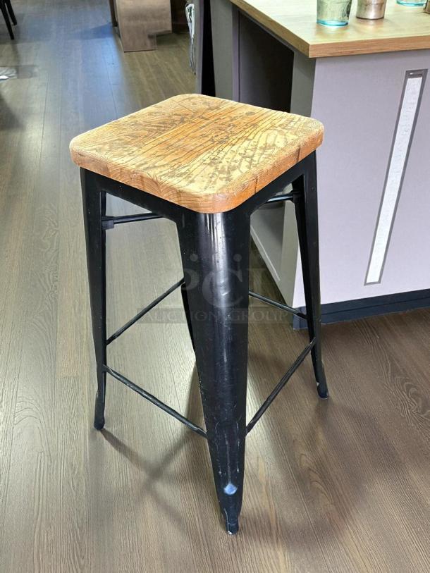 Design Form industrial counter bar stool, 26" height, wood seat, black metal frame, 330LB capacity, in great condition.