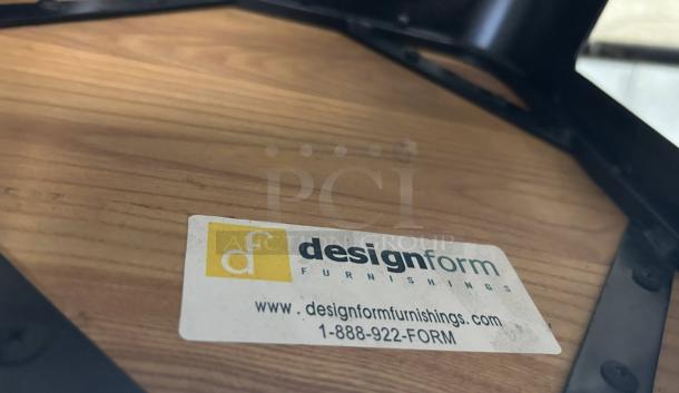 Design Form Counter Bar Stool with wood seat, 26” height, 330LB capacity. In great condition. Label shows brand and contact info.