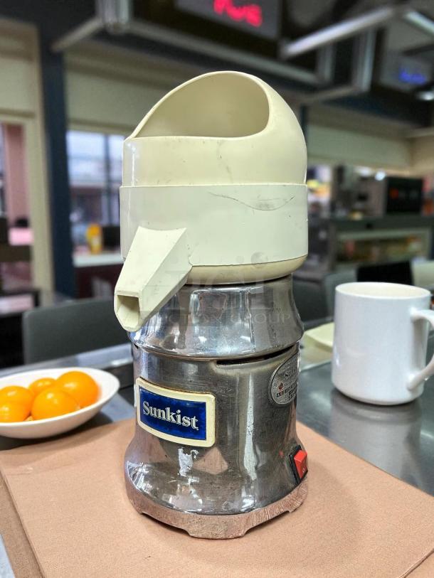 Sunkist J-1 Commercial Citrus Juicer, excellent condition, 115V, 3450 RPM, tested and working, chrome finish, visible Sunkist logo.