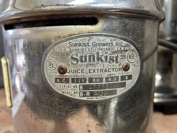 Sunkist J-1 commercial citrus juicer, excellent condition, 115V, 3450 RPM. Includes label showing model and specs.