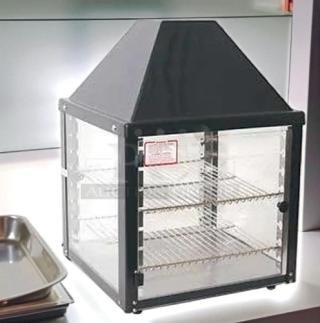 Wisco 680-1 food warming merchandiser, black, excellent condition. Features single glass door, 2 wire shelves.