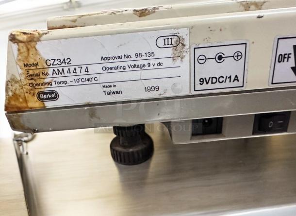 Berkel CZ342 digital price computing scale, operating at 9V DC, tested and working, with model and serial labels visible.