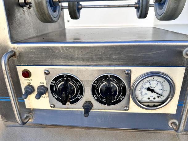 Lumar Ideal II LU2X25S meat tumbler control panel, featuring pump switch, timer dials, and a pressure gauge.