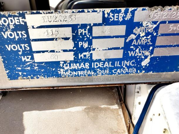 Lumar Ideal II LU2X25S meat tumbler label showing model, voltage, and company details. Slight wear visible.