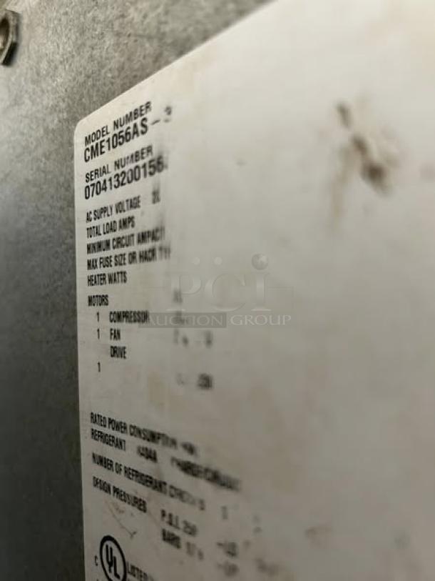 Label on Scotsman CME1056AS commercial ice maker, showing model and serial number, tested and in superb condition.