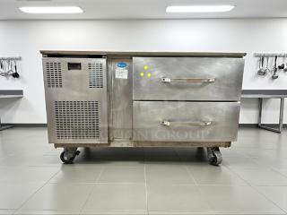 Randell 2-drawer refrigerated chef base, 115V, outstanding condition, stainless steel, on casters, fully tested, model label visible.
