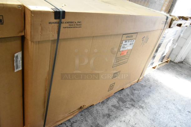 Brand new Hoshizaki HBB-3G-LD-69 bar cooler in sealed box. Features two doors, 115V, 1 phase. Label indicates model and origin.