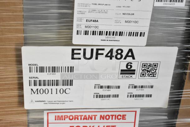 Brand new Hoshizaki EUF48A stainless steel commercial 2-door undercounter freezer packaging. Model and serial labels visible.