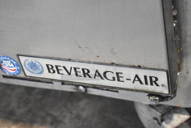 Beverage Air SPE60-24M stainless steel prep table, commercial casters visible. Made in USA label shown.