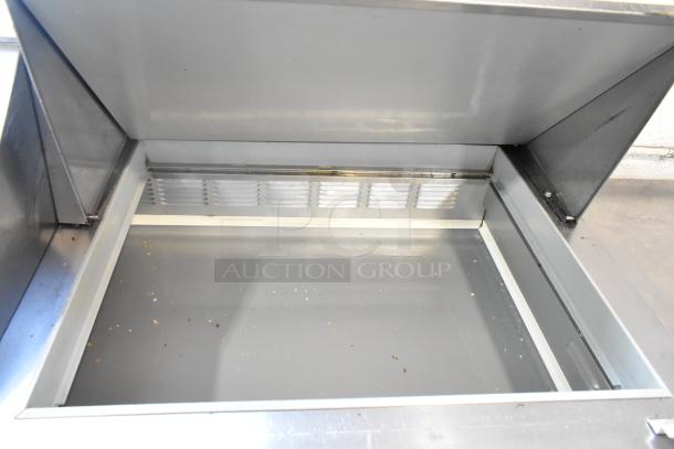 Beverage Air SPE60-24M stainless steel sandwich salad prep table, open lid, visible interior, on commercial casters.