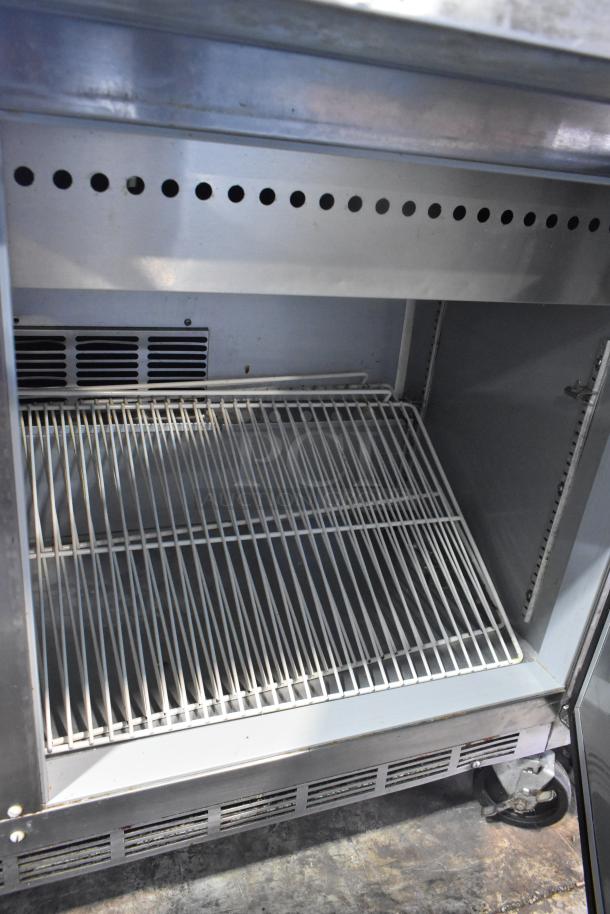 Beverage Air SPE60-24M stainless steel prep table with wire shelving and commercial casters, 115 volts, 1 phase.