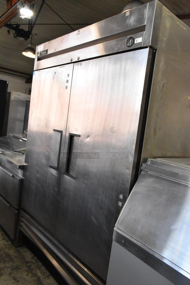 True T-49F stainless steel 2-door commercial freezer on casters, with poly-coated rack, 115V, 1 phase, good condition.