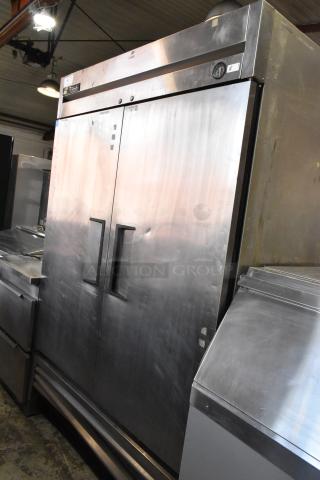 True T-49F stainless steel 2-door commercial freezer on casters, with poly-coated rack, 115V, 1 phase, good condition.