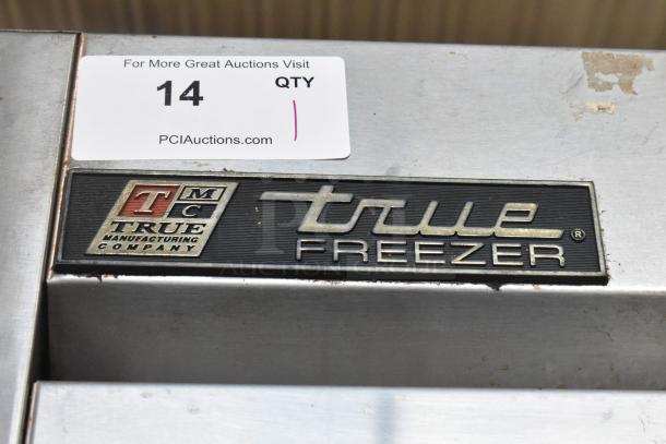 True T-49F Stainless Steel Commercial Freezer label, showing brand logo and auction sticker with "14 QTY."