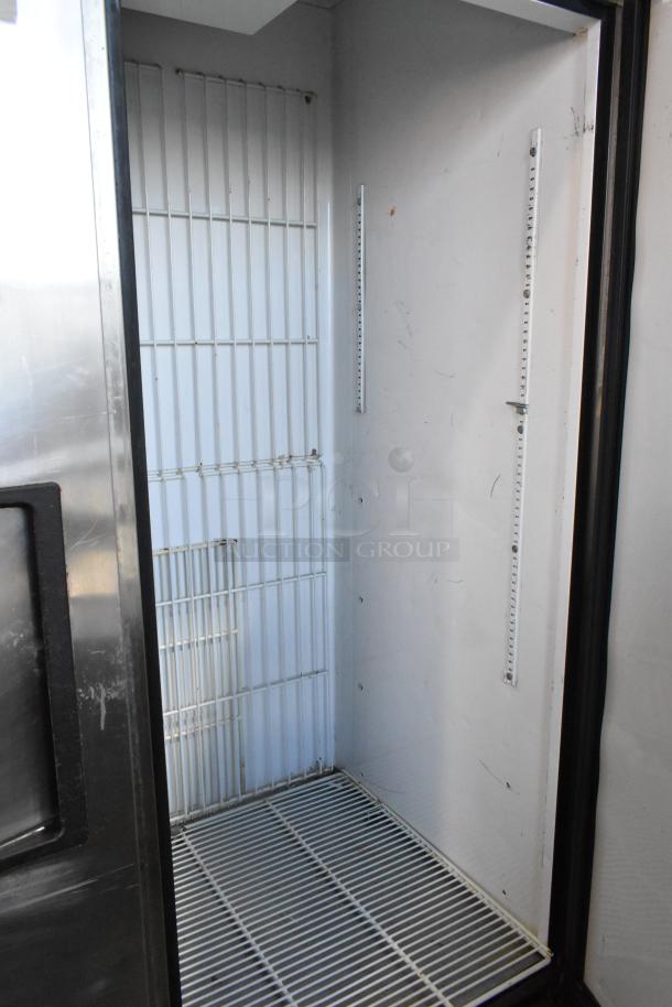 True T-49F stainless steel 2-door reach-in freezer with poly-coated rack. Features commercial casters, 115 volts, 1 phase.