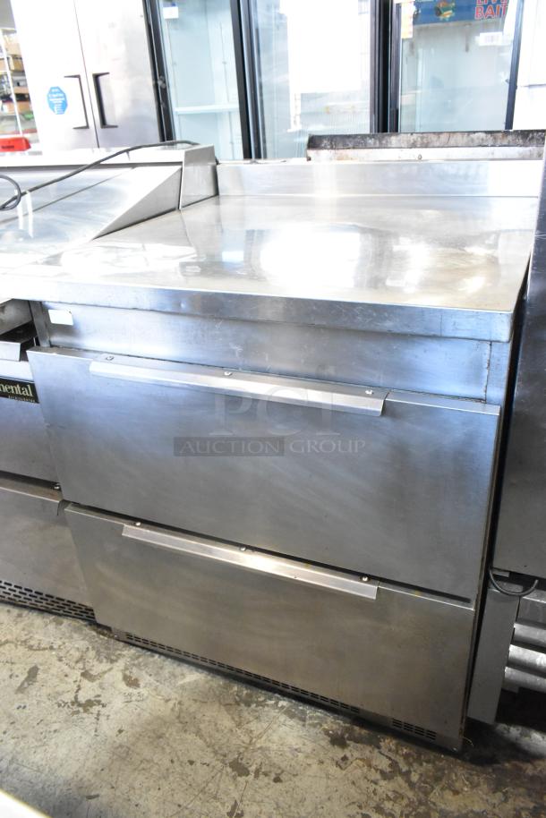 Stainless steel 2-drawer undercounter cooler, 115 volts, 1 phase, showing clean, polished surface and intact handles.