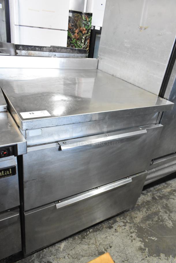 Stainless steel 2 drawer undercounter cooler, 115V, 1 phase, in good condition; features integral temperature controls.