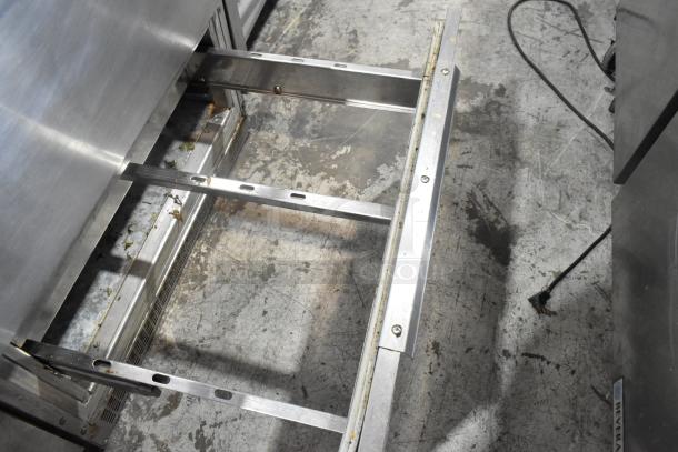 Stainless steel undercounter cooler frame, showing inner structure with no drawers, 115 volts, 1 phase.
