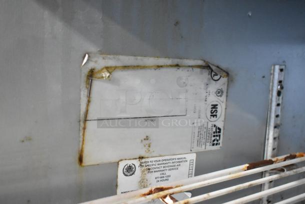 Beverage Air stainless steel commercial 2-door undercounter cooler, 115 volts, 1 phase, shows interior labels and moderate wear.