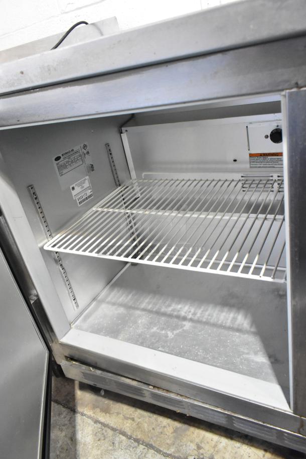 Beverage Air WTR60A stainless steel undercounter cooler with two doors on casters, 115V, 1 phase, interior shelving, model tag visible.