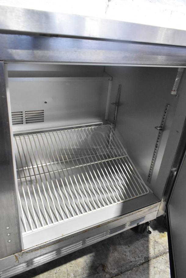Beverage Air WTR60A stainless steel 2-door undercounter cooler on casters, 115 volts, used; interior view with shelving.