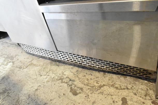 2019 Continental SW48-18M stainless steel sandwich prep table with 2 drawers and 1 door, visible wear.