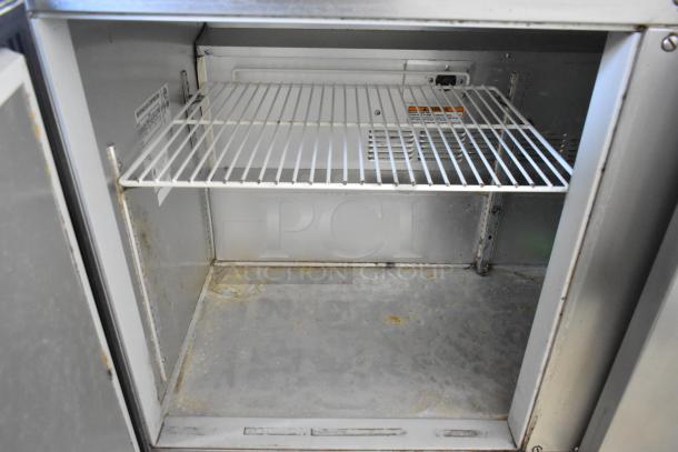 Beverage Air UCR48A stainless steel 2-door undercounter cooler on casters, 115V, showing interior and wire shelf condition.