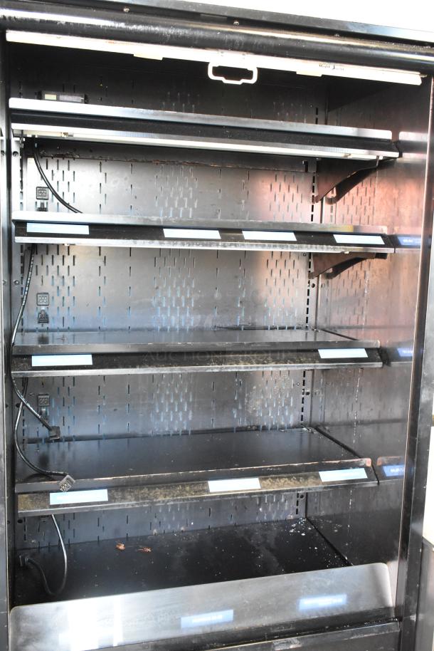 Structural Concepts Oasis B32EW metal commercial reach-in merchandiser, 120V, 1 Phase, several shelves, used condition.