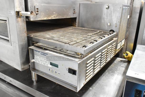 Lincoln Impinger 1132-000-D-KF017 stainless steel conveyor pizza oven, 208V, 3 phase, for commercial use, shown in used condition.