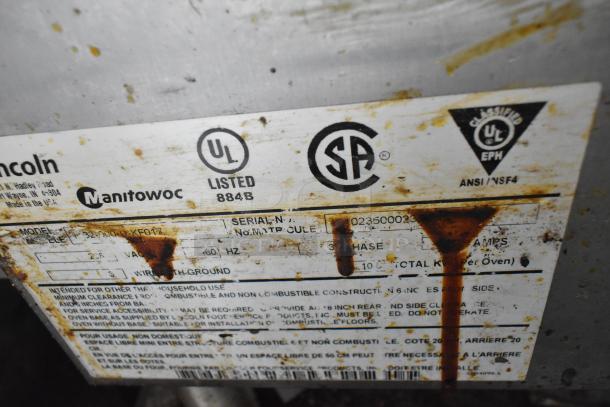 Lincoln Impinger 1132-000-D-KF017 electric conveyor pizza oven, stainless steel, 208V, 3-phase, serial label visible.
