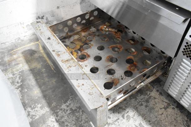 2018 Continental DL48G stainless steel chef base with two drawers, on commercial casters. Visible wear and rust. 115V, 1 Phase.