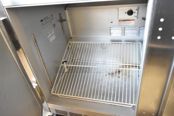 Beverage Air UCR48A stainless steel 2-door undercounter cooler. Features include 115 volts, 1 phase, on commercial casters. Interior shelves and labels visible.