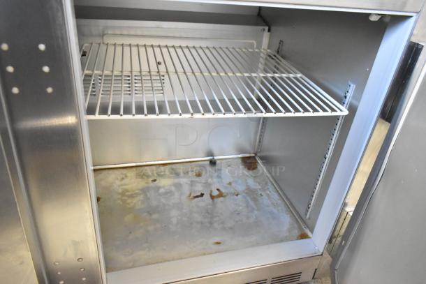 Beverage Air UCR48A stainless steel 2-door undercounter cooler, visible wear, commercial casters included, 115 volts, 1 phase.