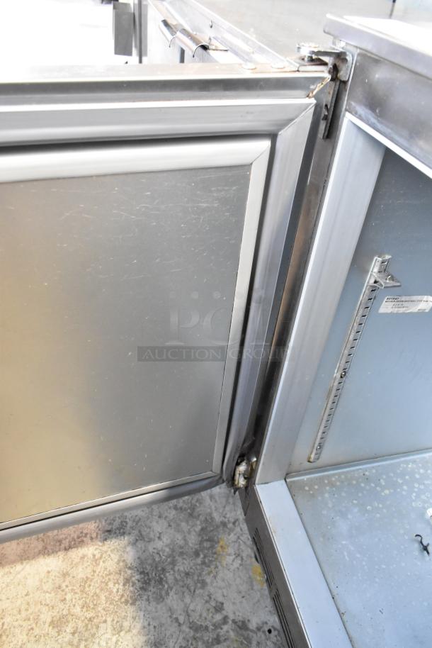 Beverage Air UCR48A stainless steel undercounter cooler, two-door, on commercial casters, 115 volts, visible wear.