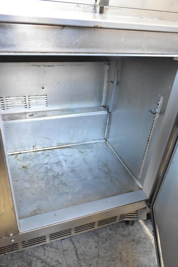 Beverage Air UCR48A stainless steel 2-door undercounter cooler, commercial casters, 115V, 1 phase, interior wear visible.