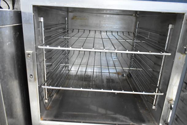 Alto Shaam 750-S stainless steel heated holding cabinet with racks. Features commercial casters, 120 volts, 1 phase.