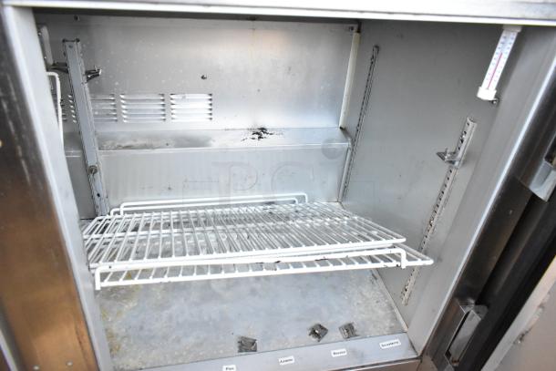 Beverage Air UCR48A stainless steel undercounter cooler, 2-door, on commercial casters, interior racks, used condition.