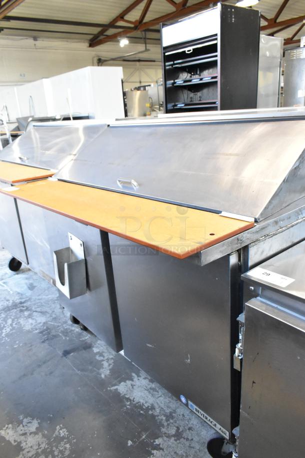 Beverage Air SPE48-18M stainless steel prep table on casters; ideal for commercial use, with cutting board and storage.