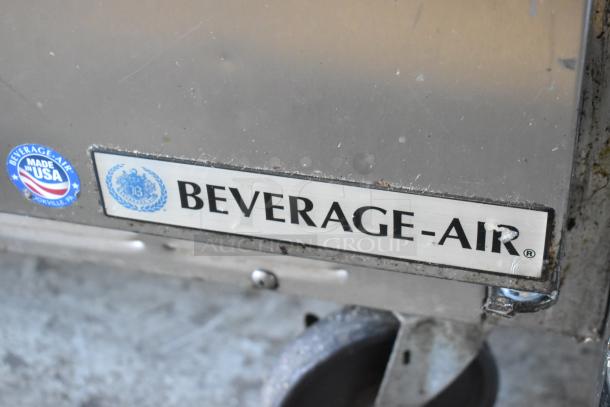 Beverage Air SPE48-18M stainless steel prep table, commercial casters, visible logo, and "Made in USA" label.