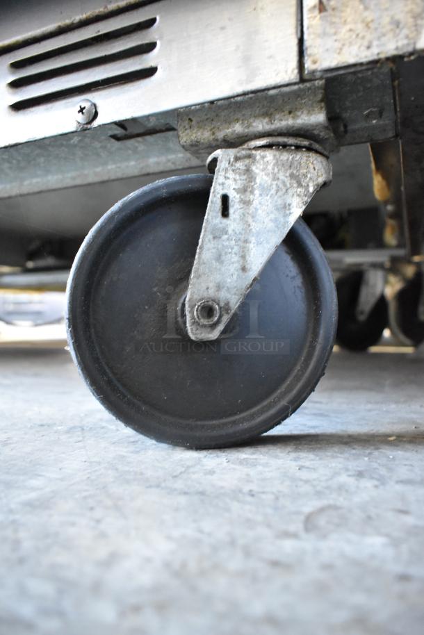 Beverage Air SPE48-18M-HMP stainless steel prep table casters, showing wear. 115V, 1 phase.