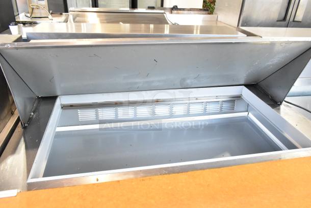 Beverage Air SPE48-18M stainless steel sandwich prep table, bain marie feature, on commercial casters, open top view.