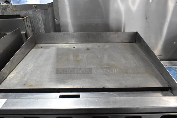 Vulcan MSA36-101 stainless steel commercial flat top griddle. Natural gas, 81,000 BTU, countertop model. Signs of use.