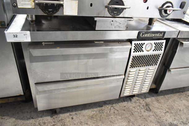 Continental stainless steel 2-drawer chef base on commercial casters, 115 volts, 1 phase, visible wear.